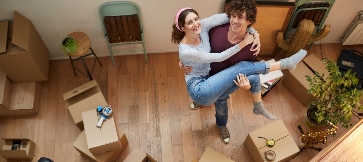 Couple celebrating in their new home after moving to Spain from the UK