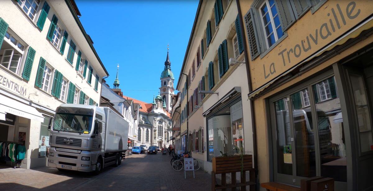 View of Frauenfeld old town with boutique shops and baroque-style church in the background