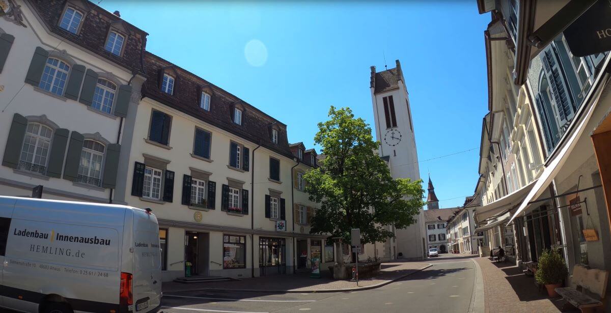 Historic buildings and church clock tower in Frauenfeld old town on a sunny day