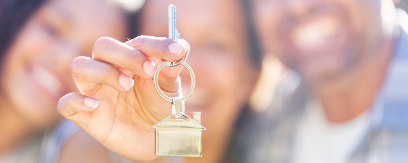 Close-up of house key symbolising new home in Australia after moving from UK Close-up of house key symbolising new home in Australia after moving from UK