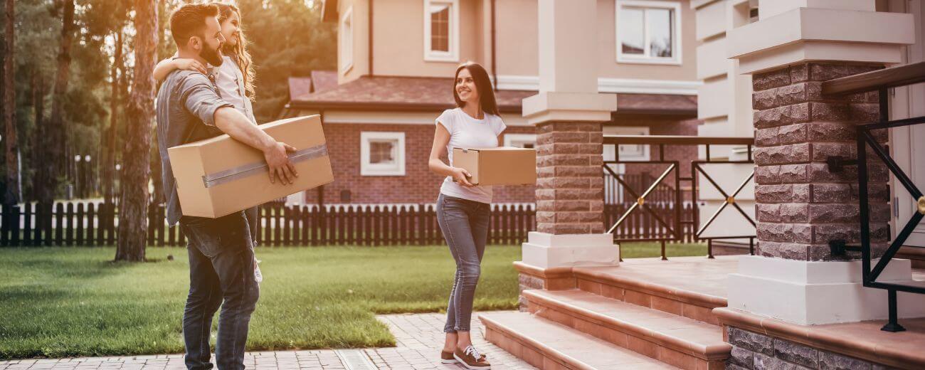 Family arriving at new home after moving to New Zealand from the UK with removal boxes Family arriving at new home after moving to New Zealand from the UK with removal boxes