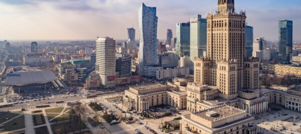 Warsaw city skyline with the Palace of Culture and Science and modern buildings, representing Poland’s growth and lifestyle for Brits moving to Poland from the UK.
