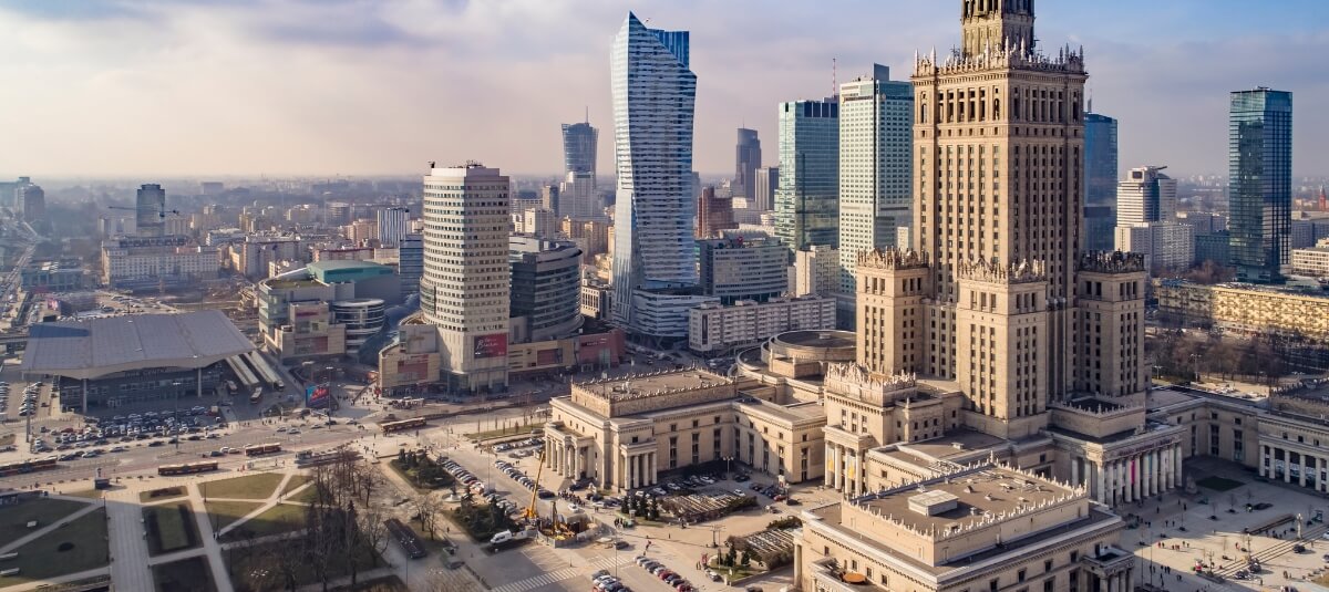 Warsaw city skyline with the Palace of Culture and Science and modern buildings, representing Poland’s growth and lifestyle for Brits moving to Poland from the UK.