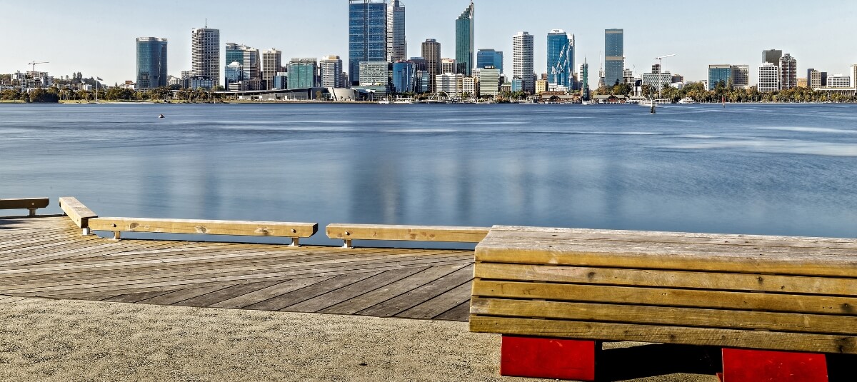 Perth skyline across the Swan River with riverside seating and open space