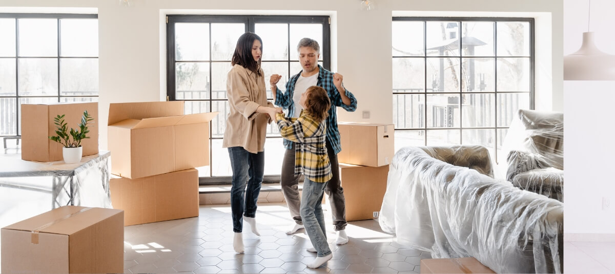 A smiling family unpacking boxes in a bright and airy room, symbolising new beginnings and adapting to a fresh lifestyle. A smiling family unpacking boxes in a bright and airy room, symbolising new beginnings and adapting to a fresh lifestyle.