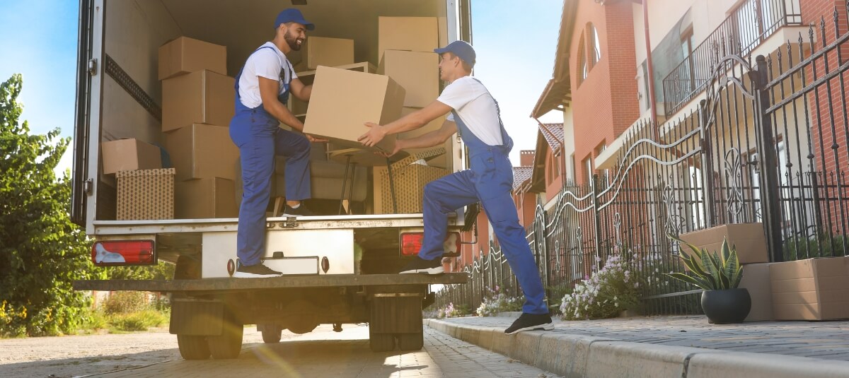 Professional movers unloading boxes during a UK to Spain removal Professional movers unloading boxes during a UK to Spain removal