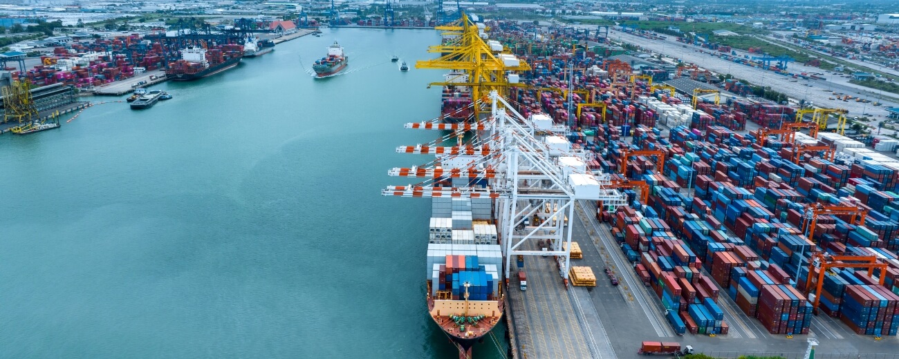 Sea freight container port Container ship at a deep-water port, showing how household goods are shipped from the UK to Thailand