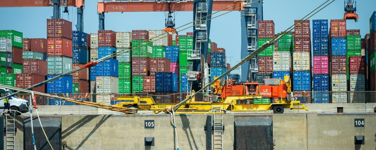 Shipping containers at a port Shipping containers stacked at a port, showing how household goods are shipped from the UK to India