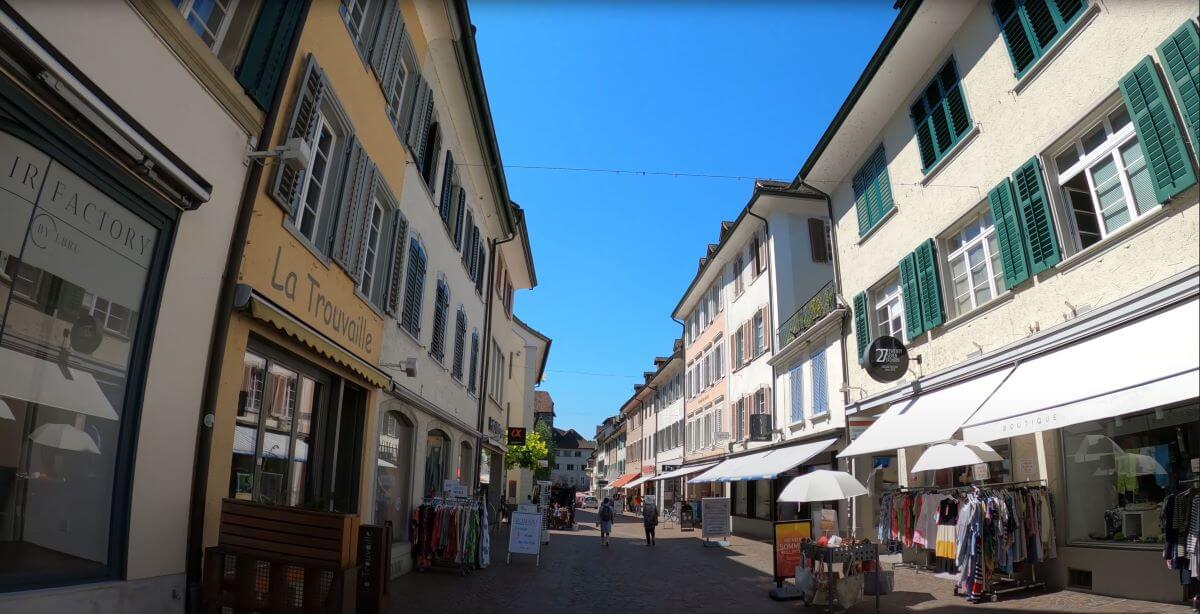 Pedestrian shopping street in Frauenfeld with local boutiques and traditional Swiss architecture