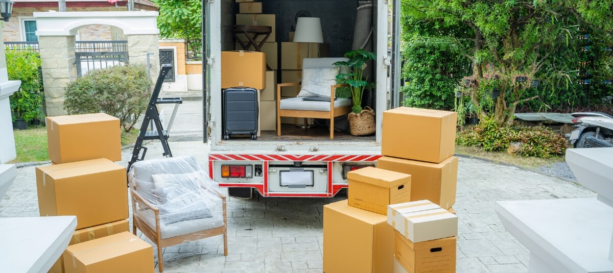 Moving van packed with boxes and furniture ready for transport, representing UK to Portugal removals for families returning home in 2026.