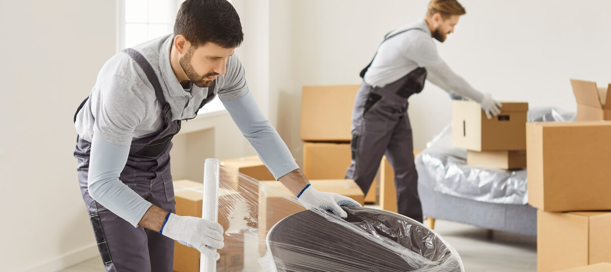 Professional movers packing household goods for a UK to Spain international removal